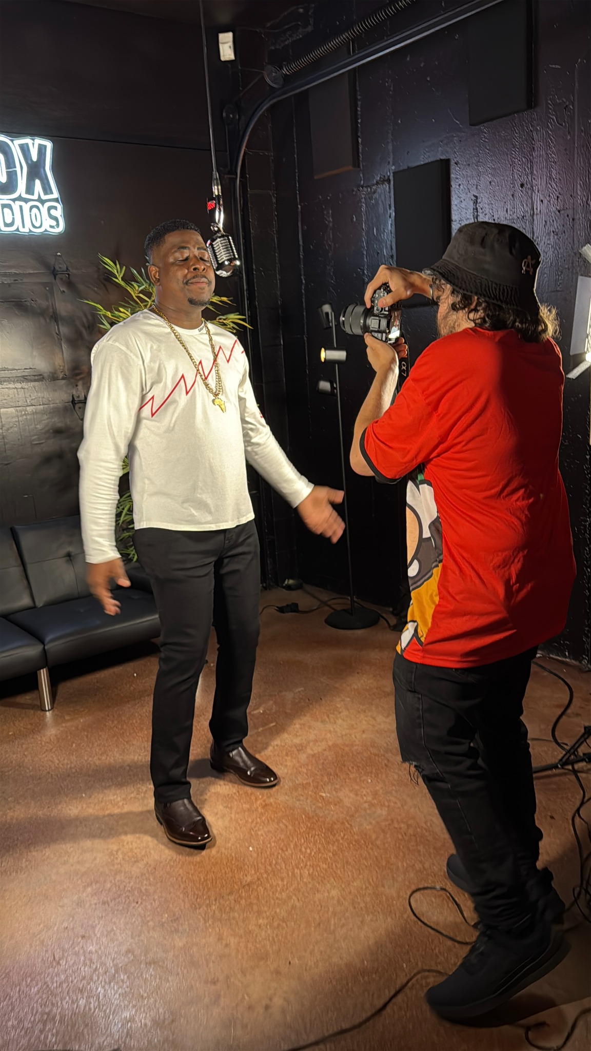 Behind the scenes photo showing Stevy Luck during a shoot at Juice Box Studios